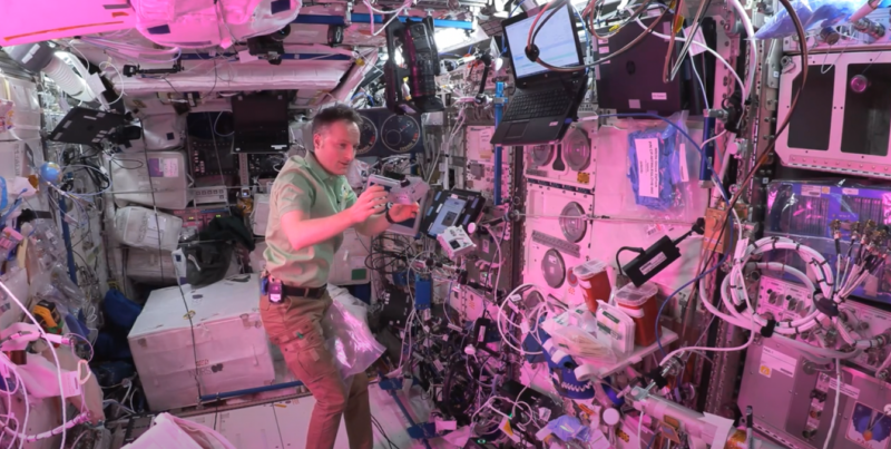 Matthias catching Astro Pis in microgravity.