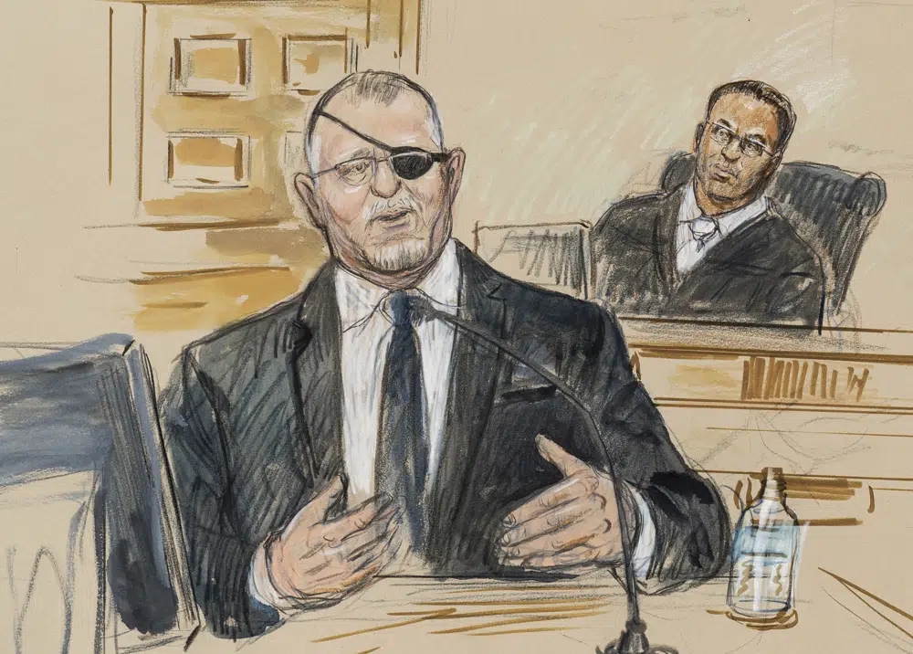 FILE - This artist sketch depicts the trial of Oath Keepers leader Stewart Rhodes, left, as he testifies before U.S. District Judge Amit Mehta on charges of seditious conspiracy in the Jan. 6, 2021, attack on the U.S. Capitol, in Washington, Nov. 7, 2022. Rhodes and members of his antigovernment group will be the first Jan. 6 defendants sentenced for seditious conspiracy in a series of hearings beginning this week that will set the standard for more punishments of far-right extremists to follow. (Dana Verkouteren via AP, File)