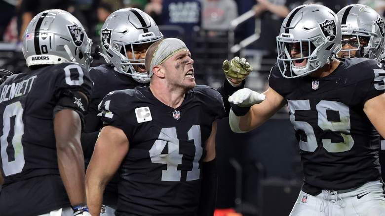 Robert Spillane (41, center) of the Raiders announced his wife was pregnant on Sunday.